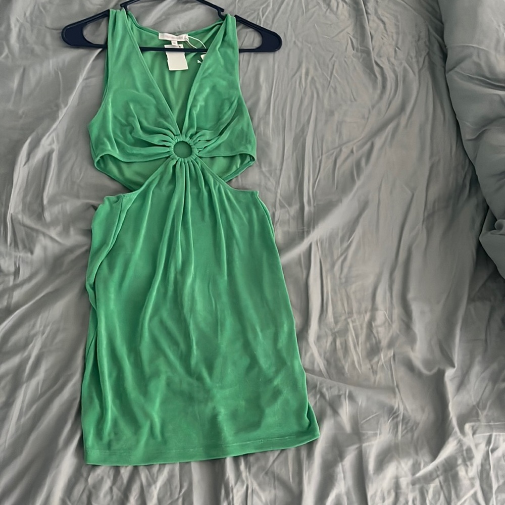 Brand new green mini dress with ring and cut out